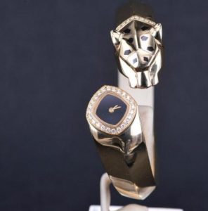 The 18k gold copy watch is decorated with diamonds.