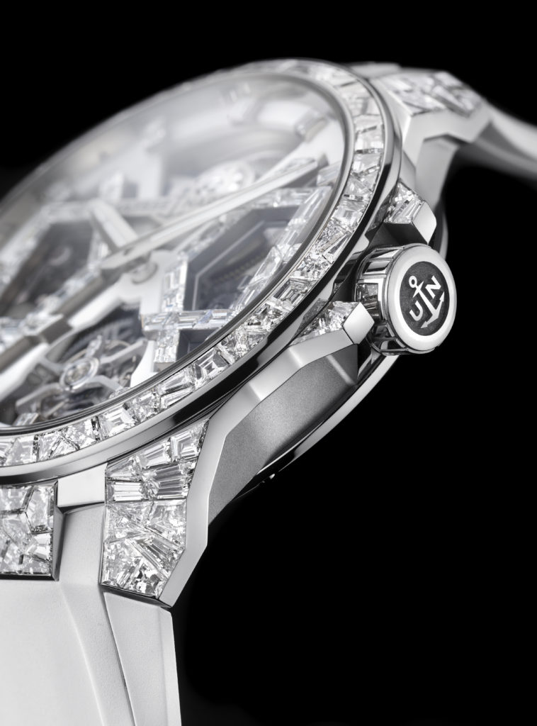 The 18k white gold fake watch is decorated with diamonds.